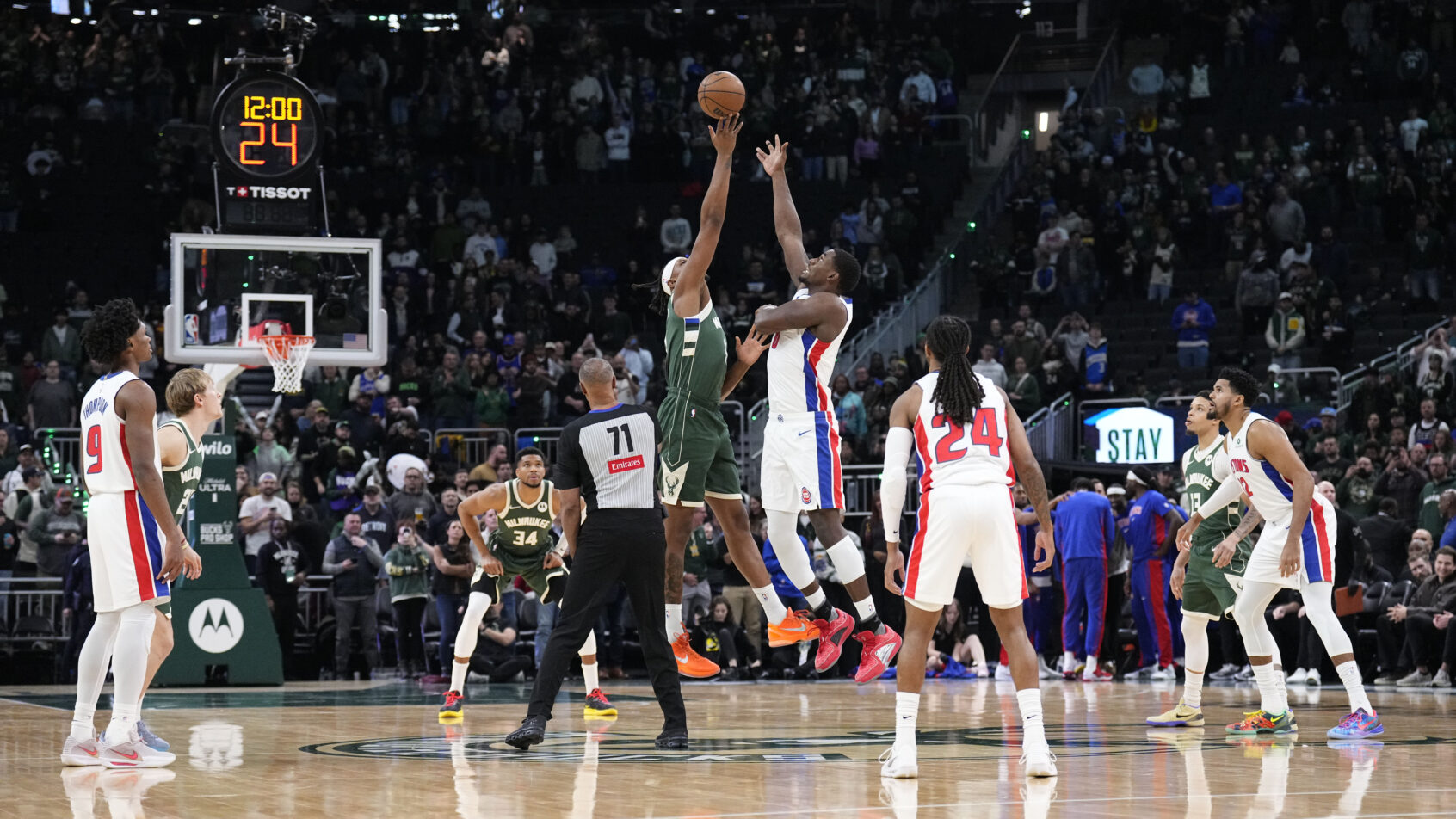 Milwaukee Bucks center Myles Turner and Detroit Pistons center Jalen Duren jump for the ball