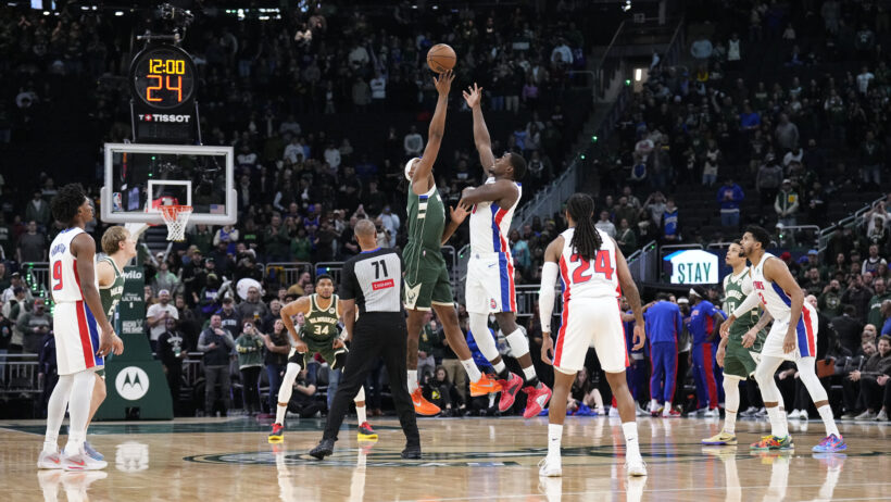 Milwaukee Bucks center Myles Turner and Detroit Pistons center Jalen Duren jump for the ball