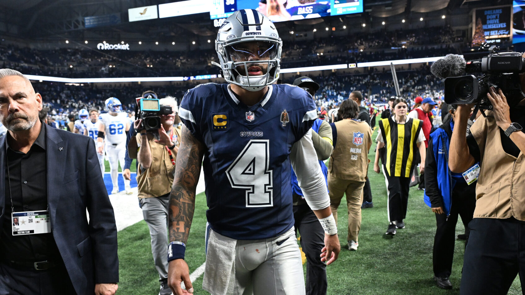 Dak Prescott leaves the field in Detroit following a Cowboys loss.