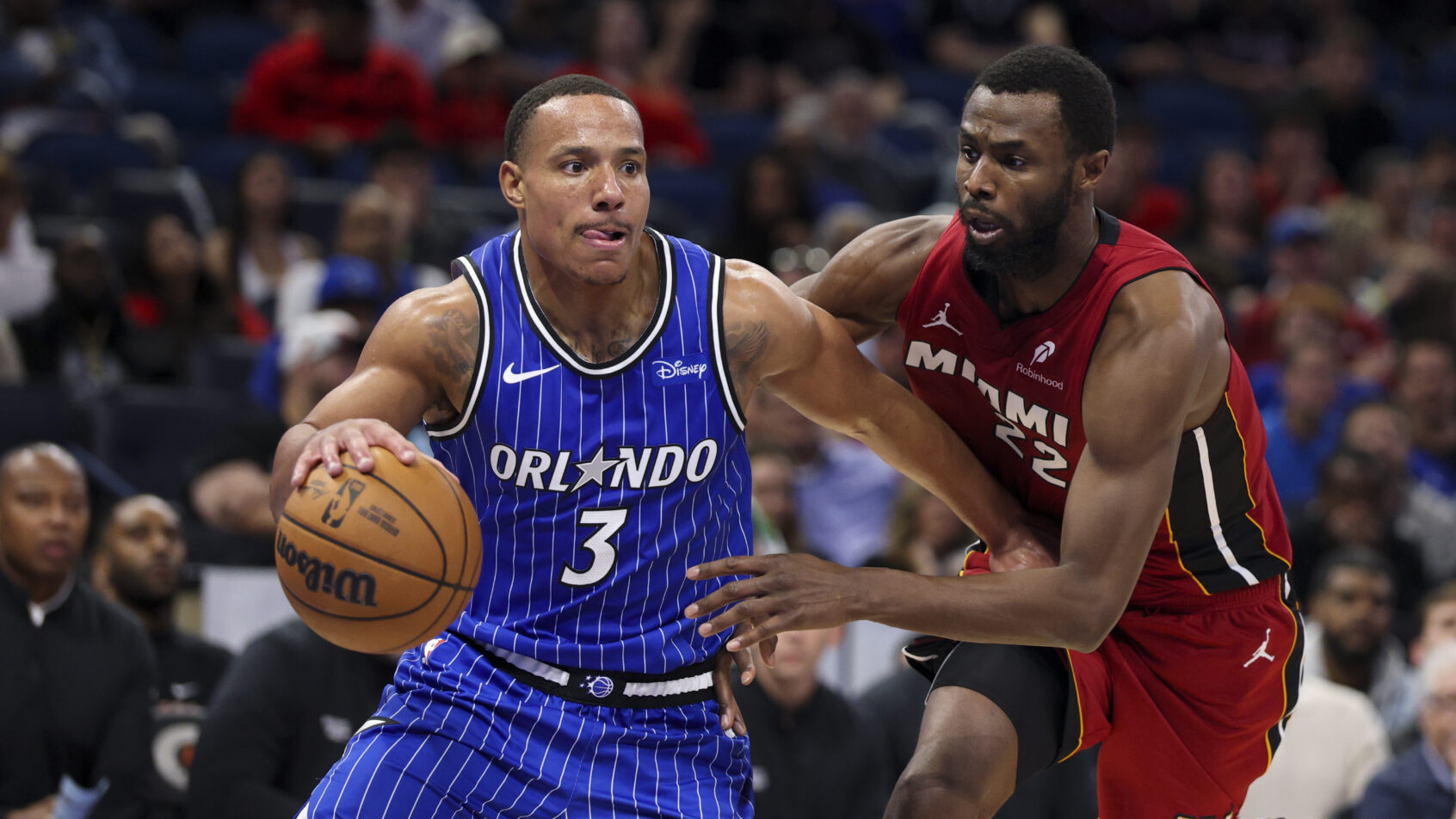 Orlando Magic guard Desmond Bane driving as Miami Heat forward Andrew Wiggins defends