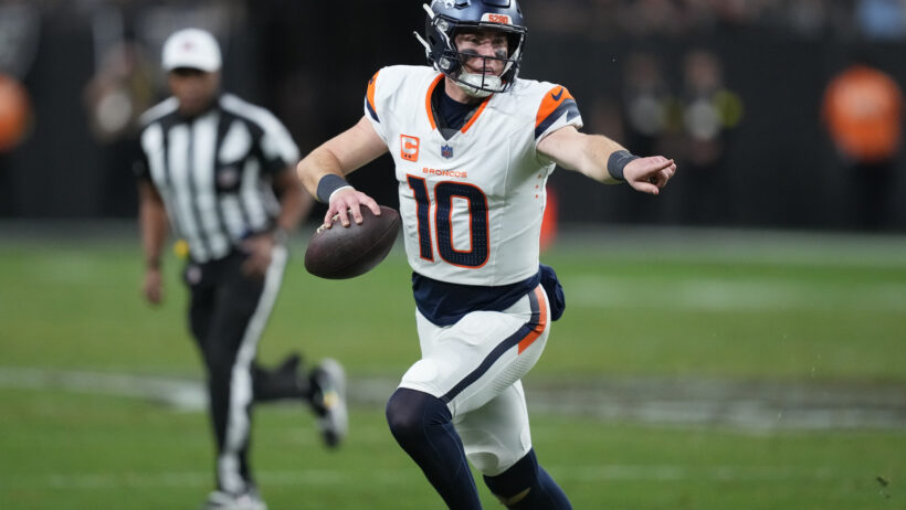 Denver Broncos quarterback Bo Nix scrambling out of the pocket