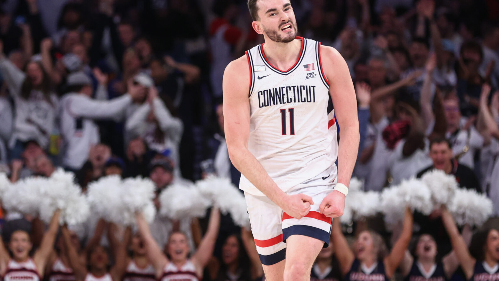 UConn Huskies forward Alex Karaban celebrates a bucket