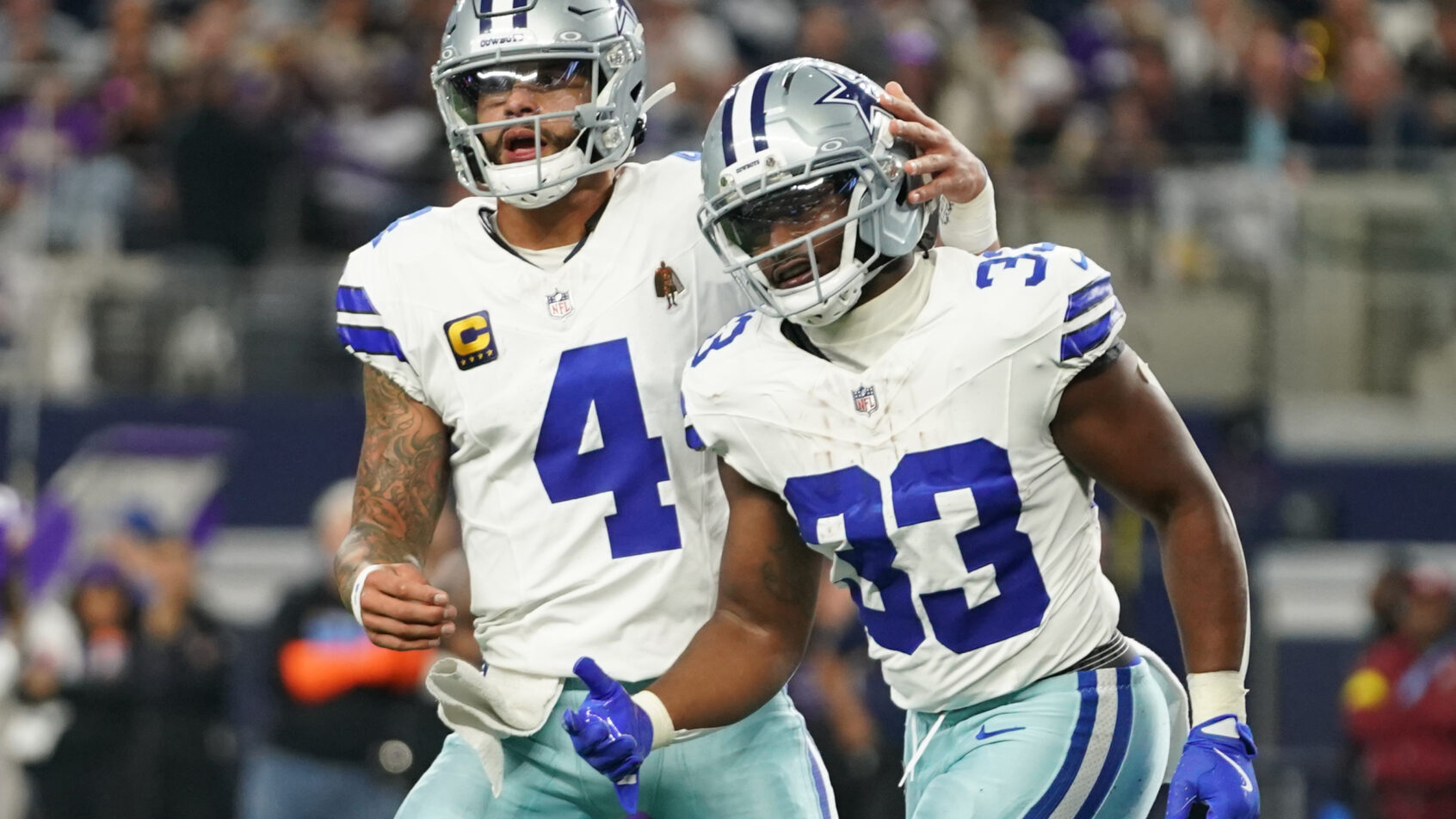 Dallas Cowboys running back Javonte Williams celebrates a TD with QB Dak Prescott