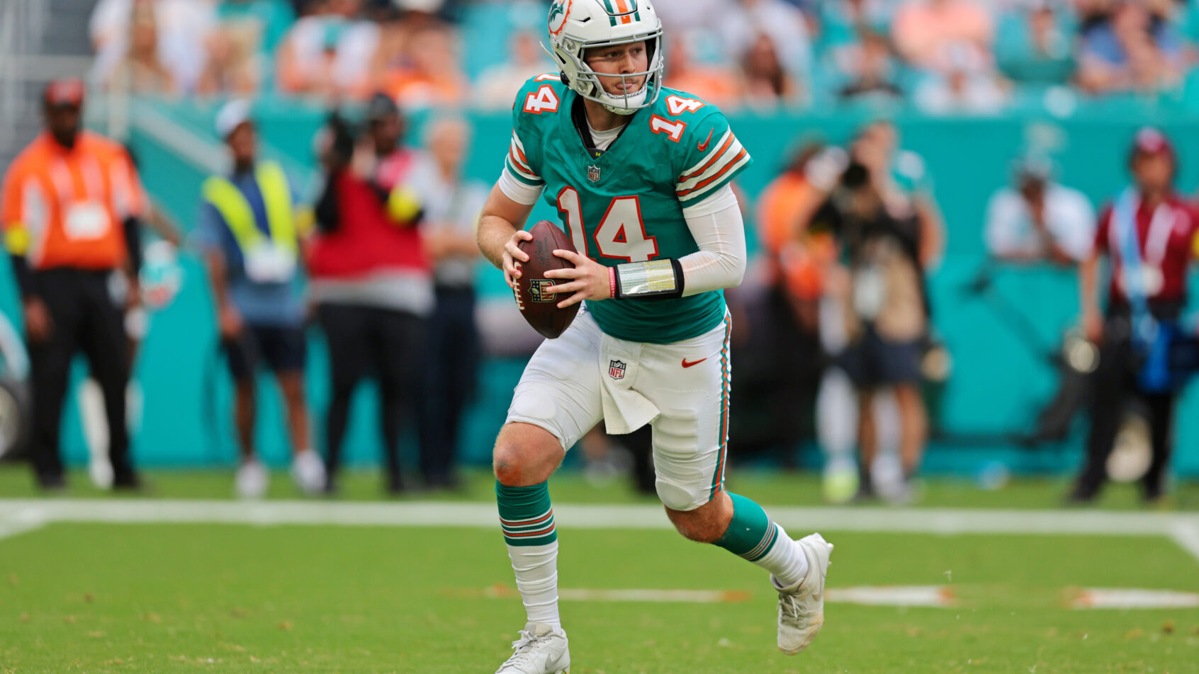 Quinn Ewers looks to throw the football