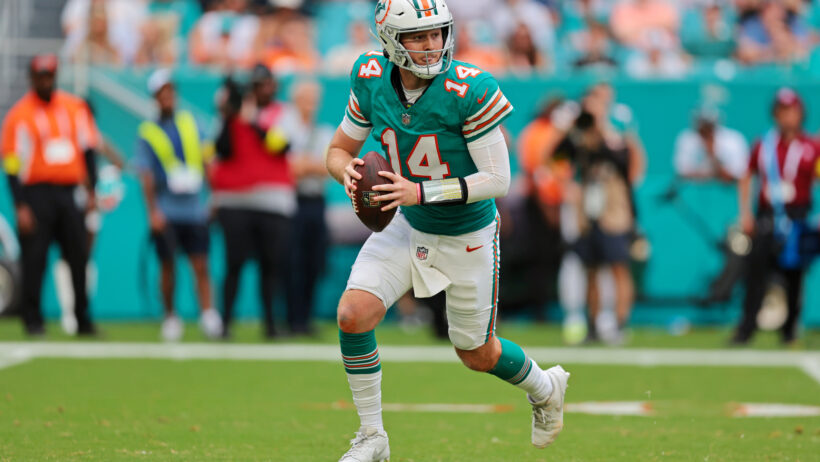 Quinn Ewers looks to throw the football