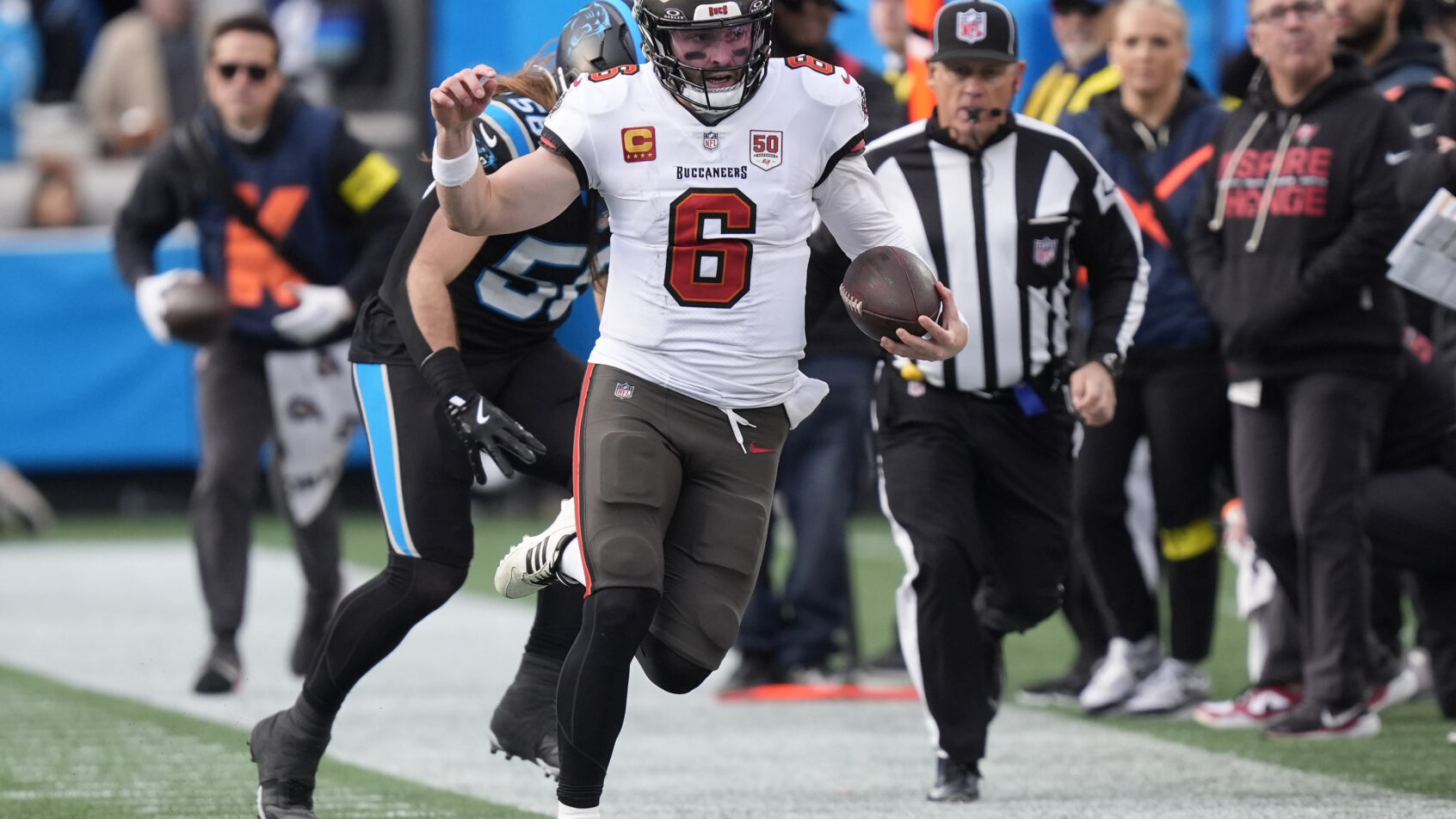 Tampa Bay Buccaneers quarterback Baker Mayfield runs with the ball against the Carolina Panthers