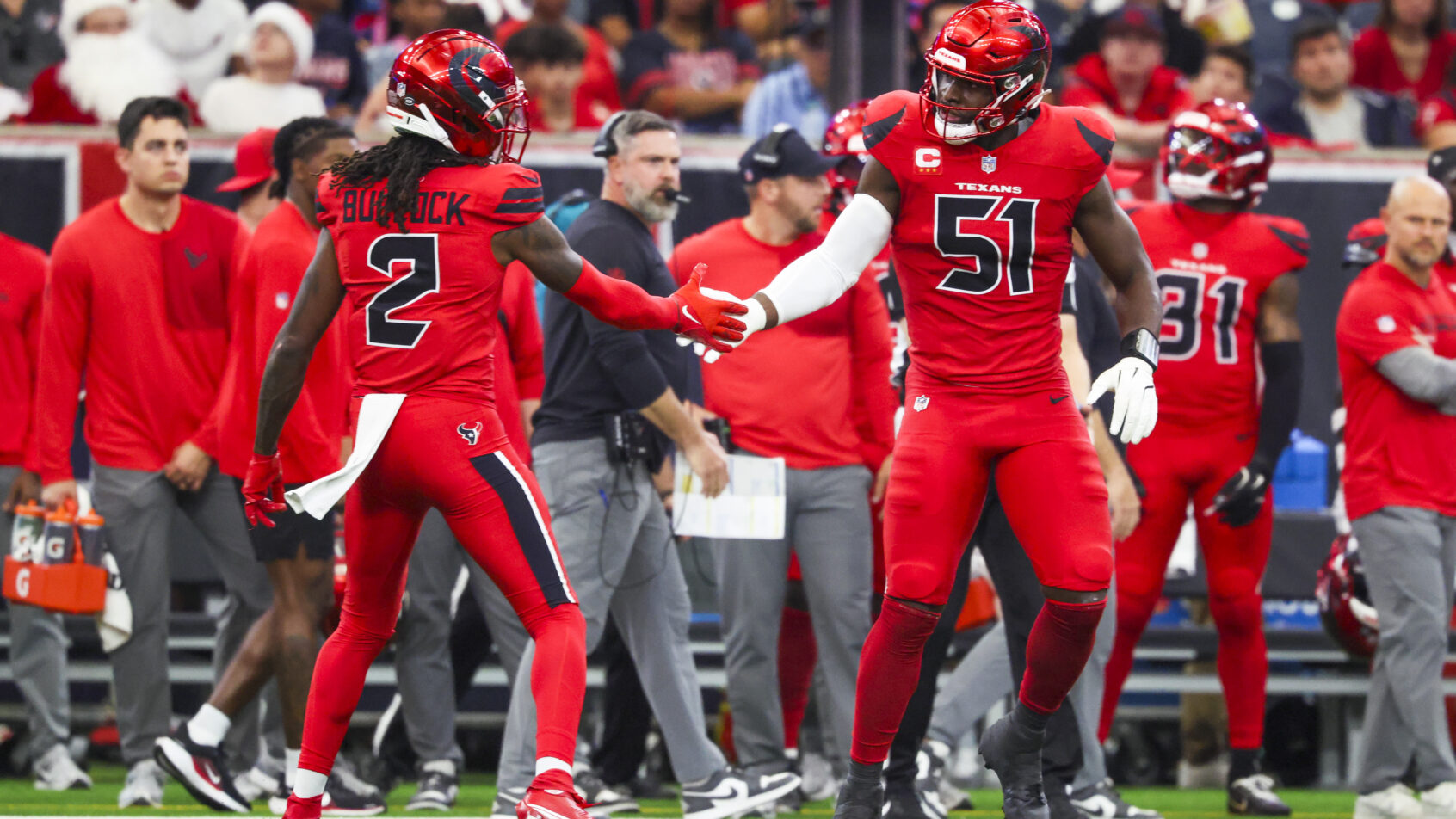 Will Anderson Jr. and Calen Bullock celebrate a defensive stop.