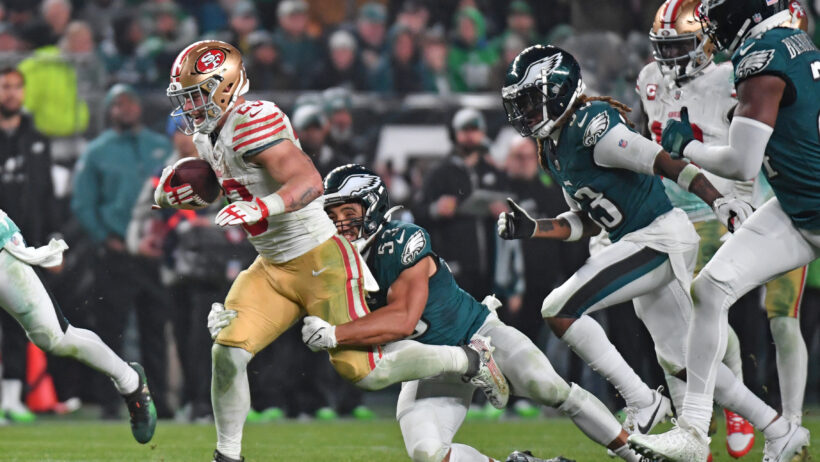 San Francisco 49ers running back Christian McCaffrey runs with the ball