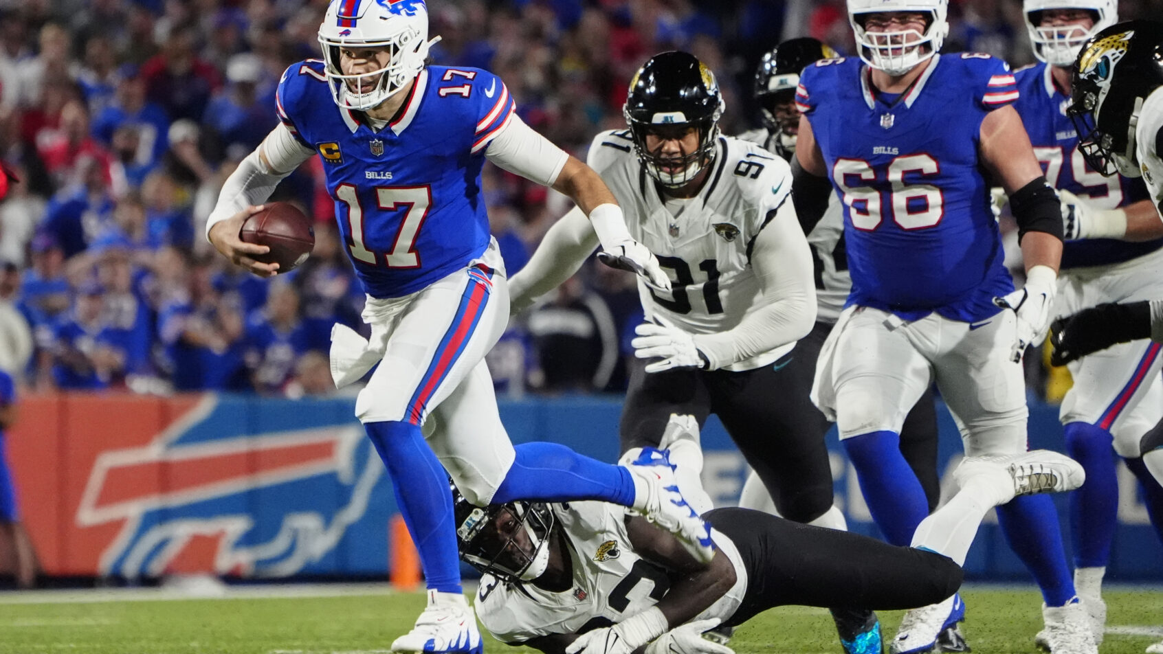 Buffalo Bills quarterback Josh Allen runs with the ball