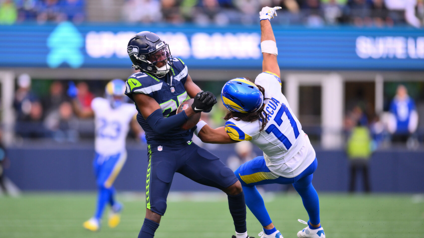 Seattle Seahawks cornerback Riq Woolen intercepting a pass
