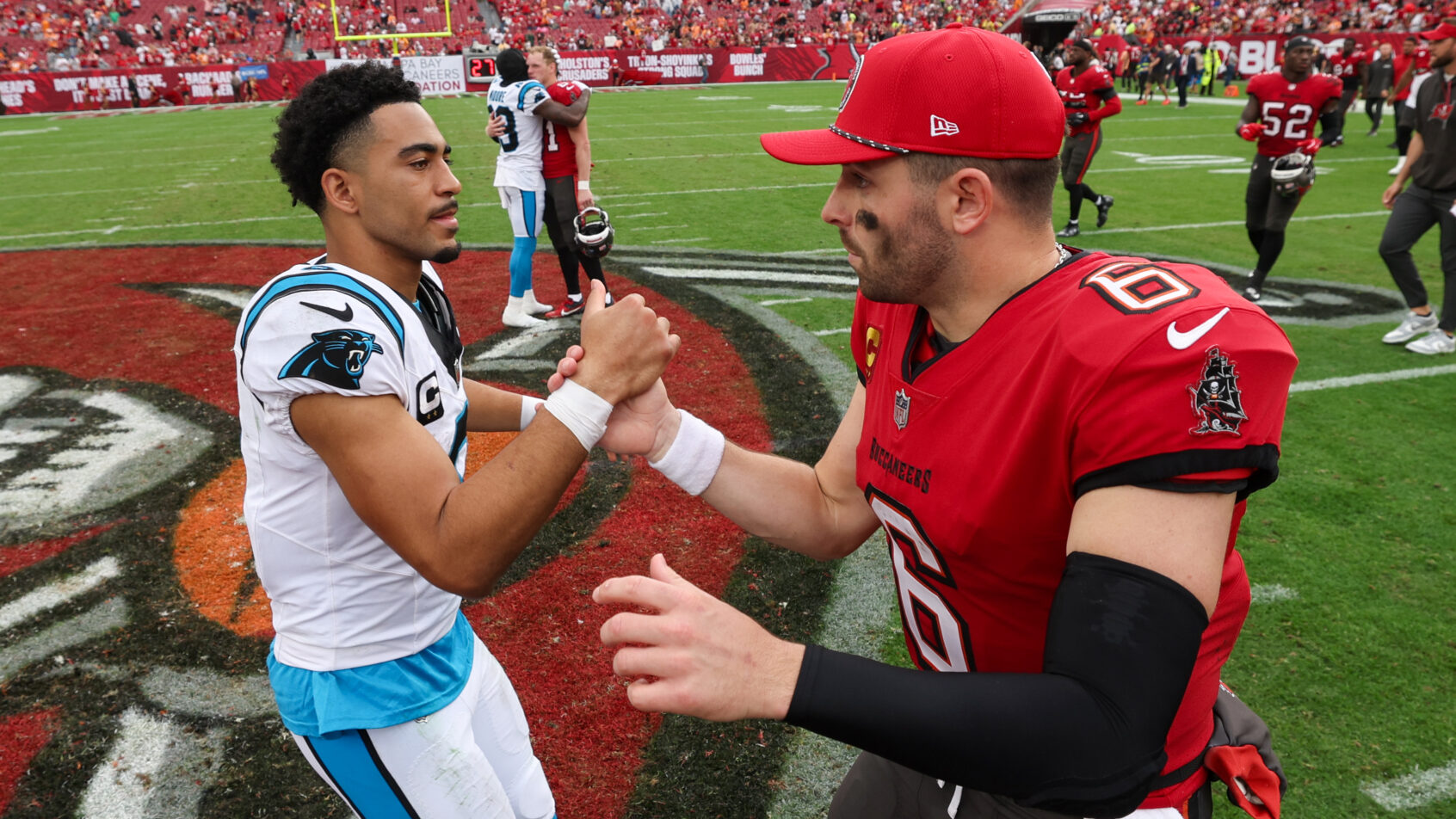 Bryce Young shakes hands with Baker Mayfield