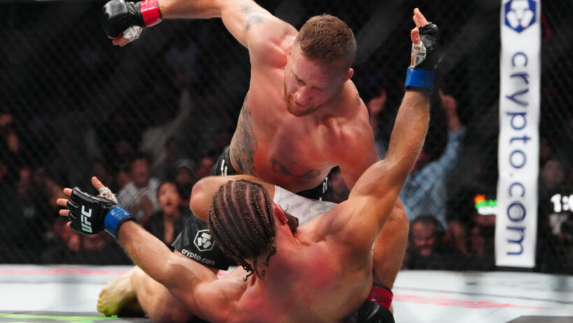 Justin Gaethje throws a punch against Rafael Fiziev.