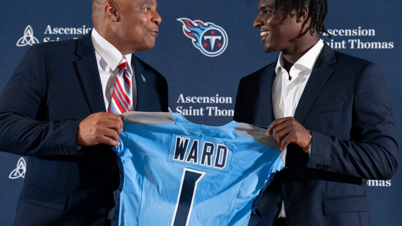Cam Ward and Warren Moon holding Ward's Titans 1st pick jersey