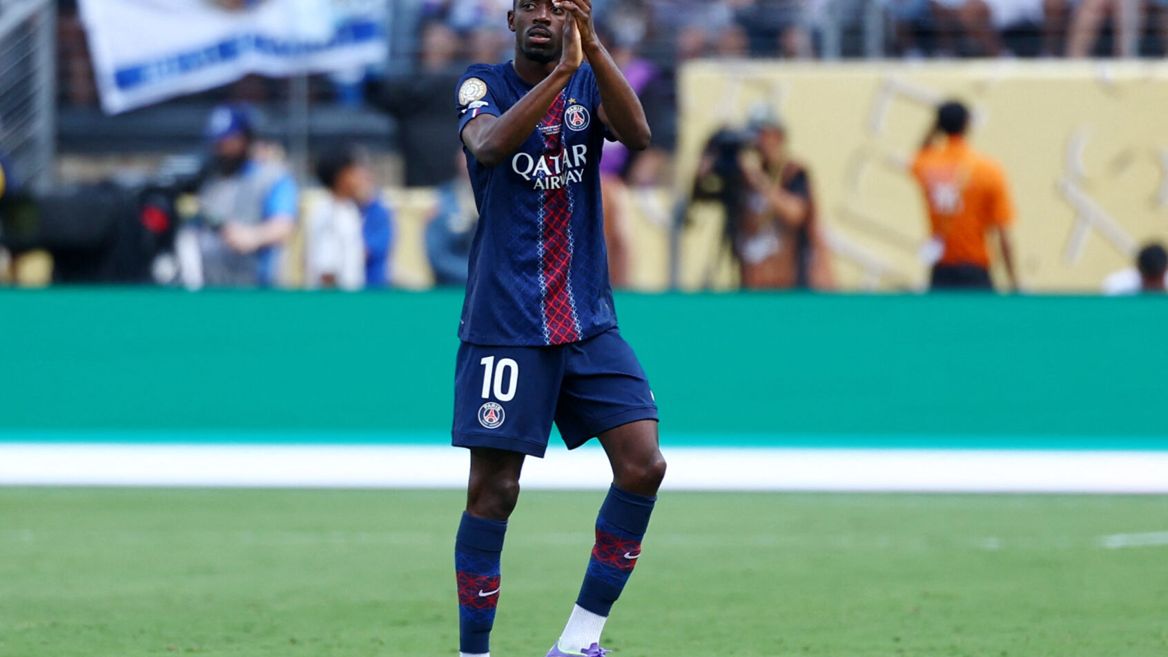 Paris Saint-Germain forward Ousmane Dembele applauding