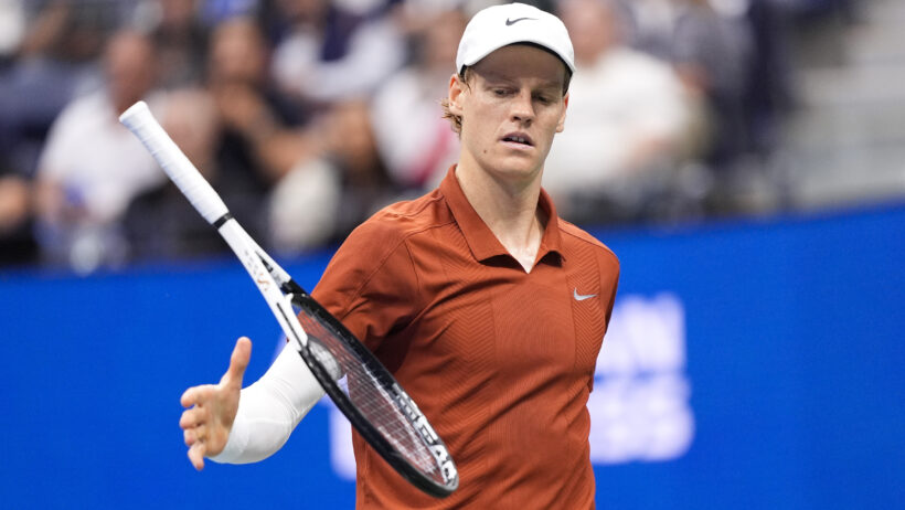 Jannik Sinner catching racquet