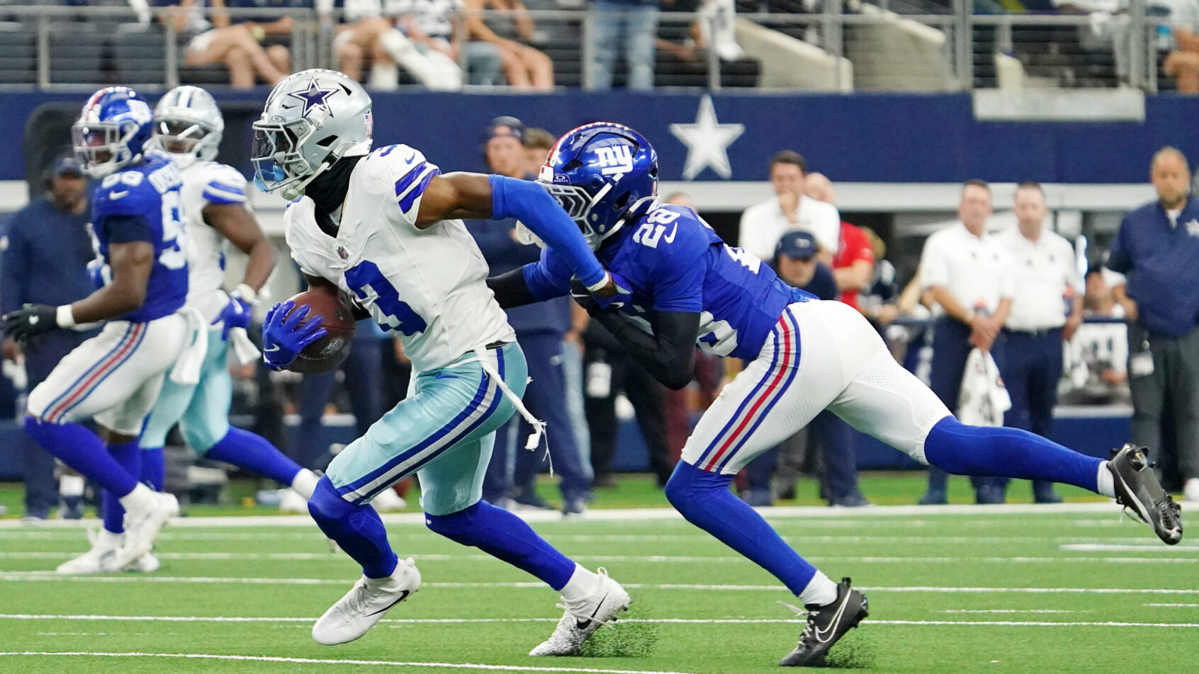 Dallas Cowboys wide receiver George Pickens runs with the ball against the NY Giants