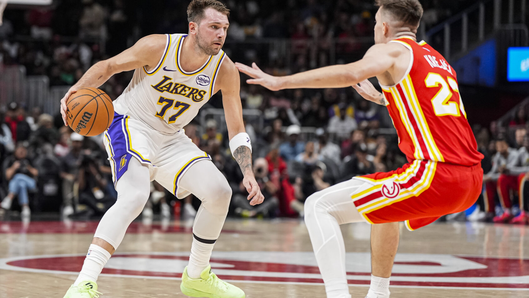 Los Angeles Lakers guard Luka Doncic guarded by Atlanta Hawks guard Vit Krejci