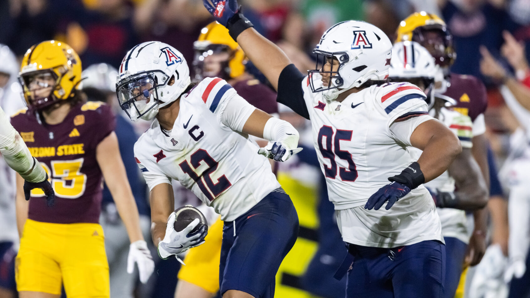 Arizona's defense celebrates a fumble recover versus Arizona State.