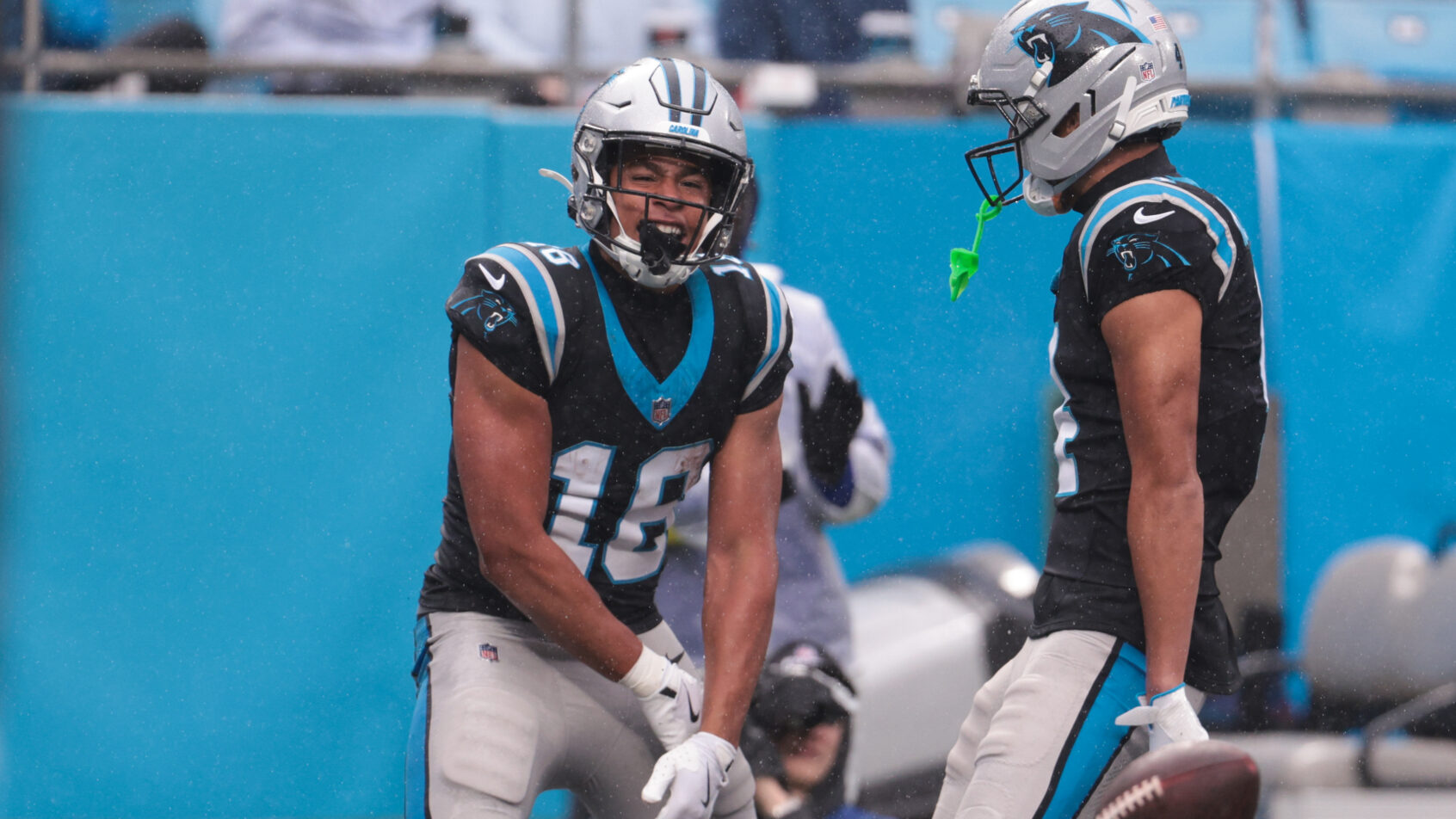 Jalen Coker celebrating after scoring a touchdown