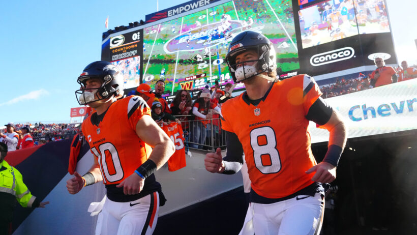 Denver Broncos QBs Bo Nix and Jarrett Stidham running onto the field