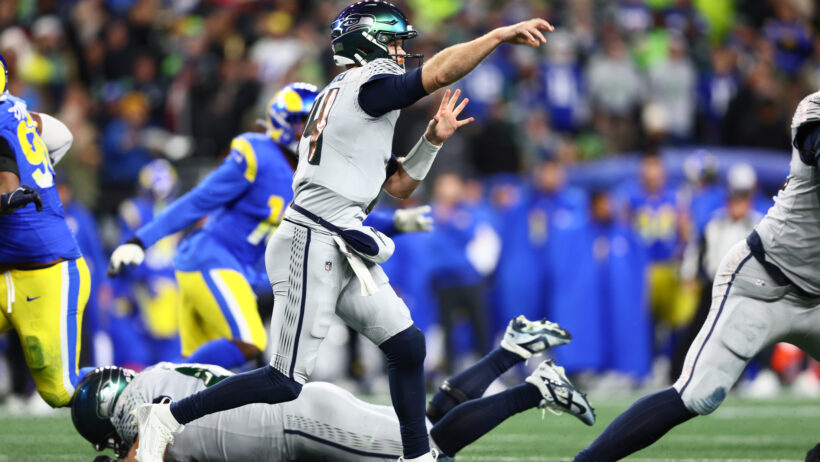 Seattle Seahawks quarterback Sam Darnold throwing a pass