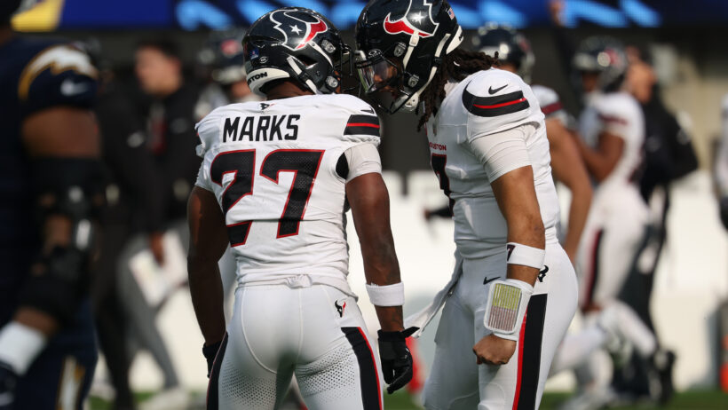 Houston Texans quarterback C.J. Stroud and running back Woody Marks celebrate a touchdown