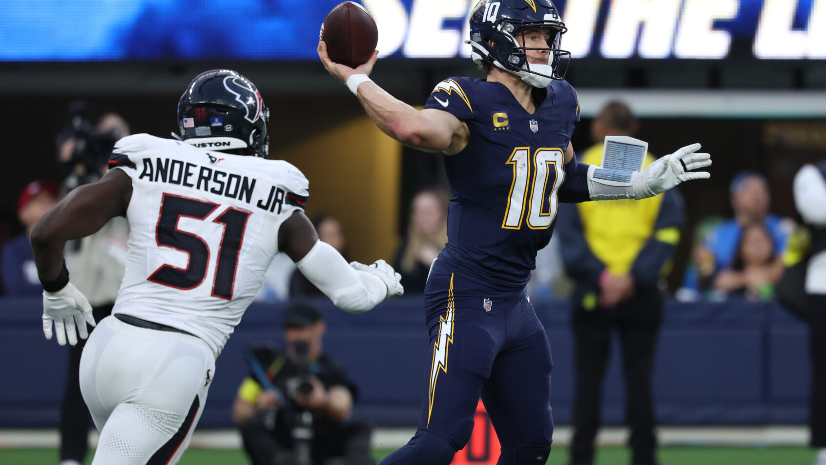 Justin Herbert throwing the football