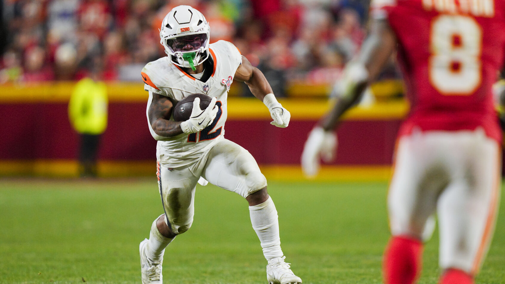 RJ Harvey gets the ball out in space against the Chiefs.