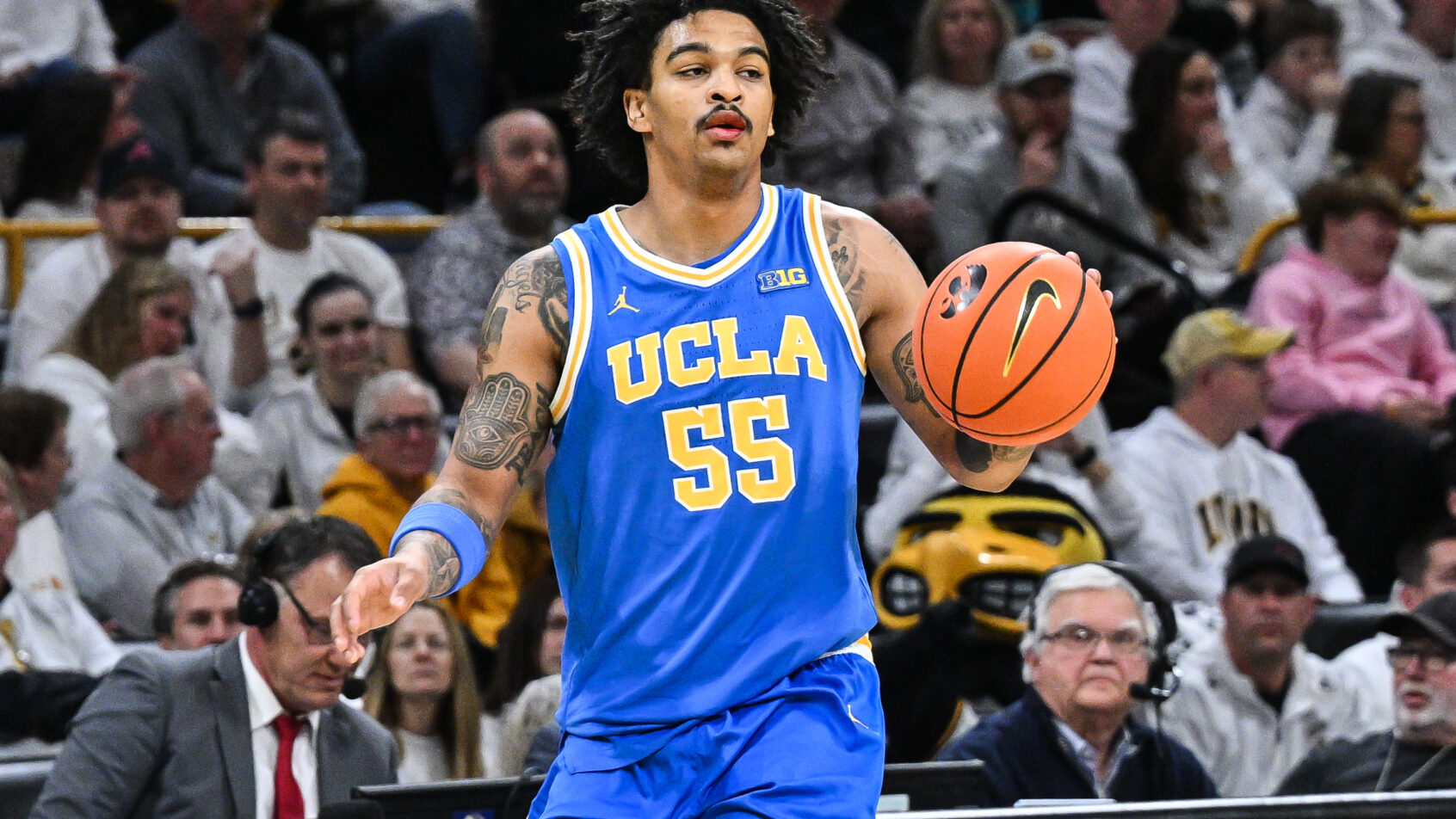 UCLA Bruins guard Skyy Clark controls the ball