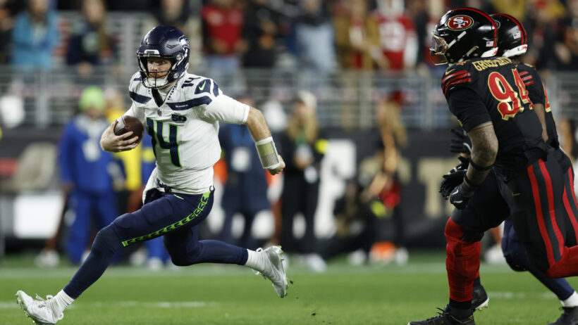 Seattle Seahawks quarterback Sam Darnold runs with the ball