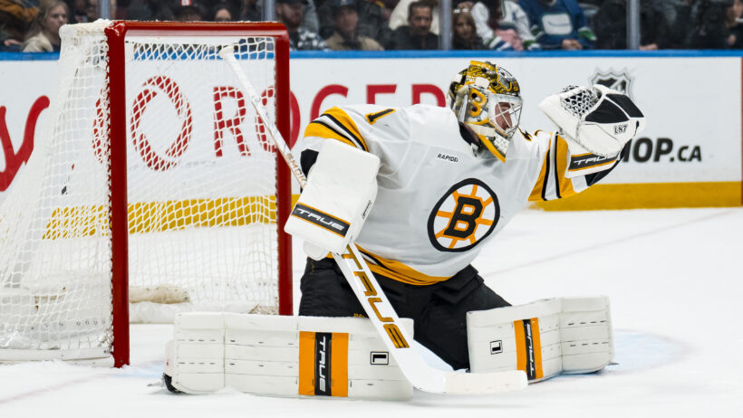 Boston Bruins goalie Jeremy Swayman (1) makes a save against the Vancouver Canucks