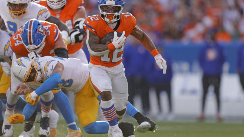 RJ Harvey carrying the football