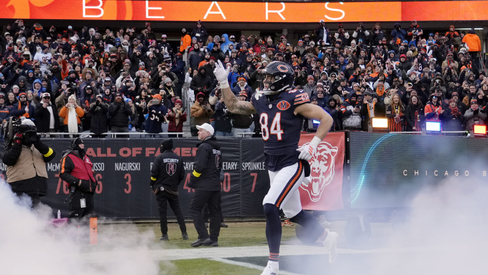 Colston Loveland running onto the field