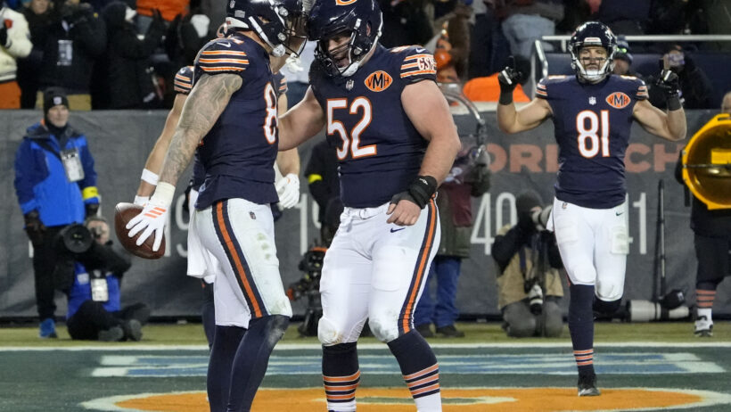 Colston Loveland celebrating in the endzone after scoring a touchdown