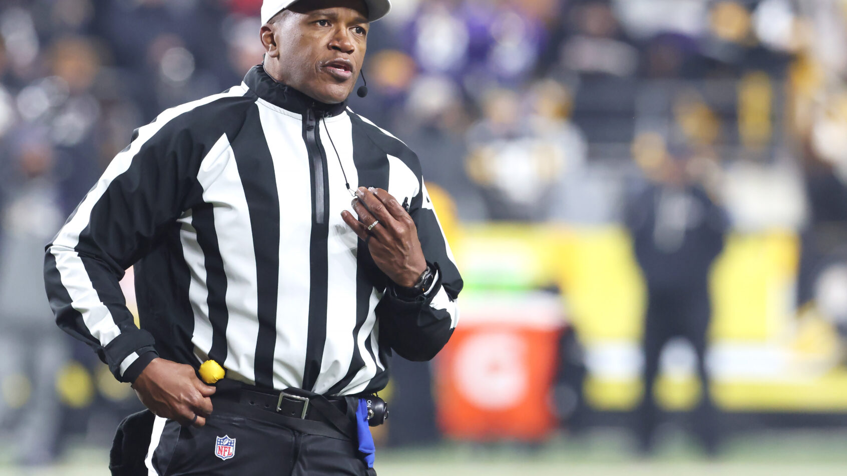 Shawn Smith calls a penalty during a Ravens-Steelers game.