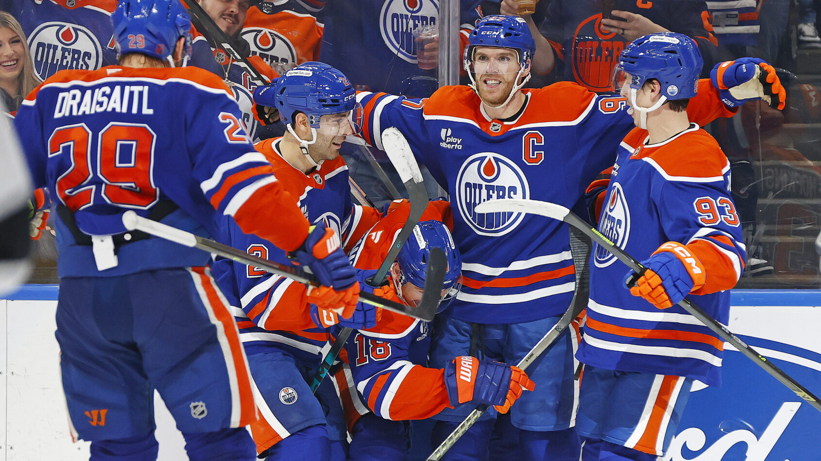 Connor McDavid celebrates with his Oiler teammates.