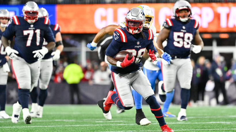 New England Patriots running back Rhamondre Stevenson carries the ball