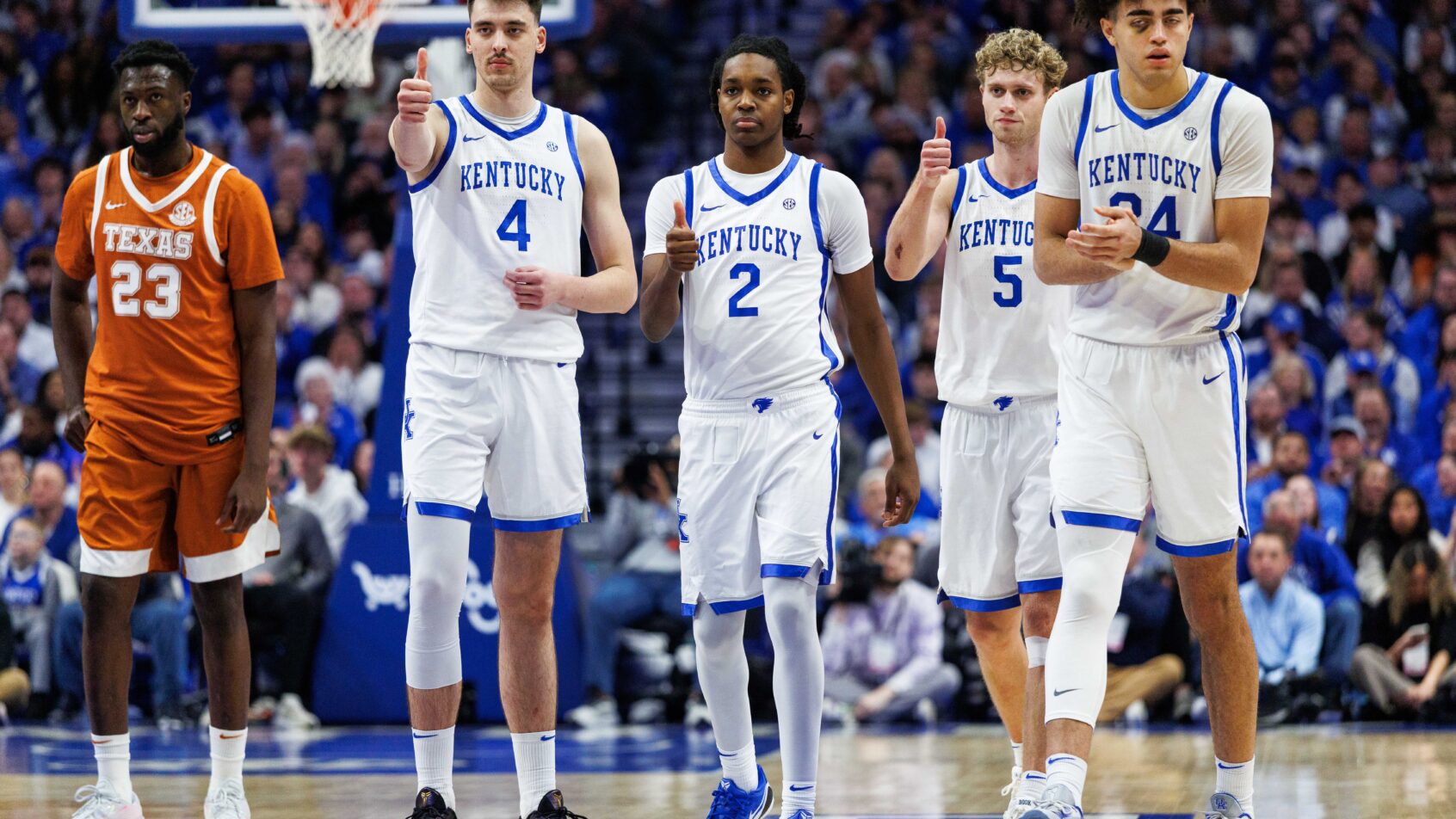 Kentucky cheers on their teammate at the free throw line.