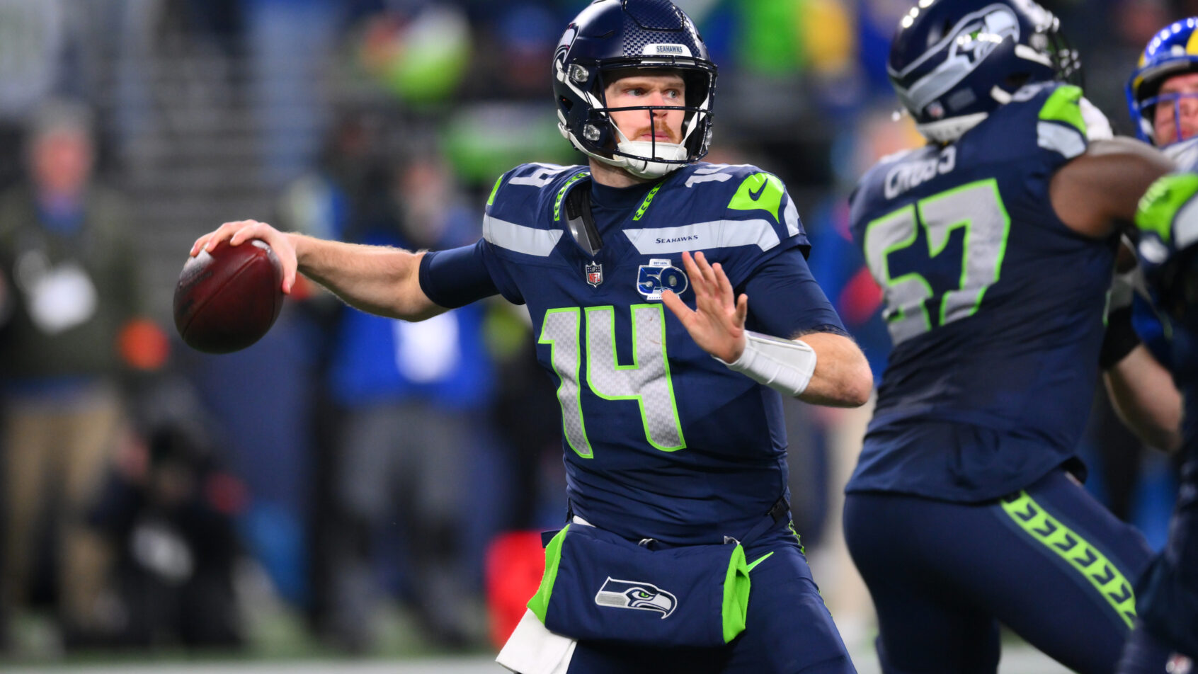 Seattle Seahawks quarterback Sam Darnold throwing a pass