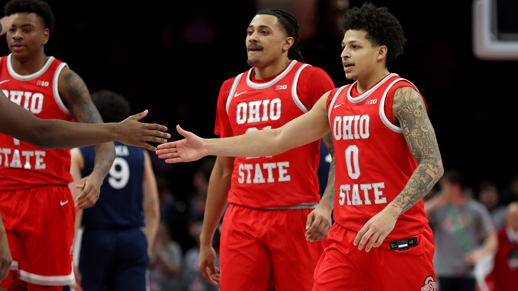 Ohio State leaves the court led by John Mobley Jr. following a timeout.