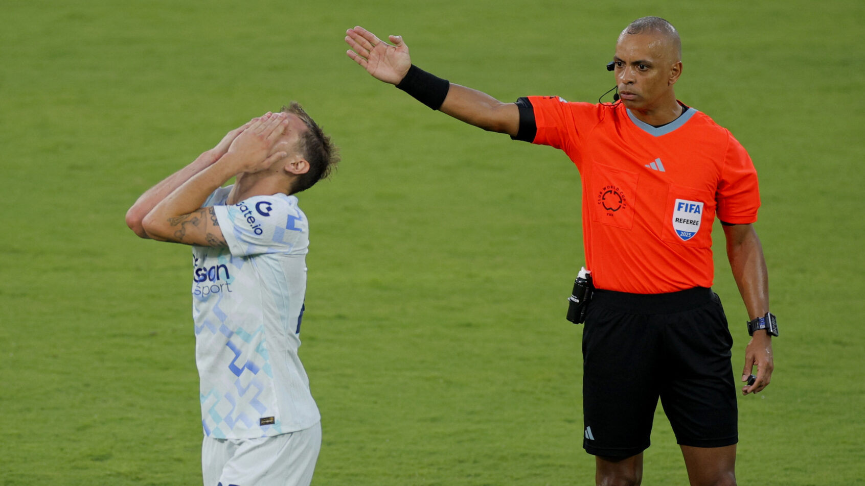 Inter Milan's Nicolo Barella holds his head in his hands