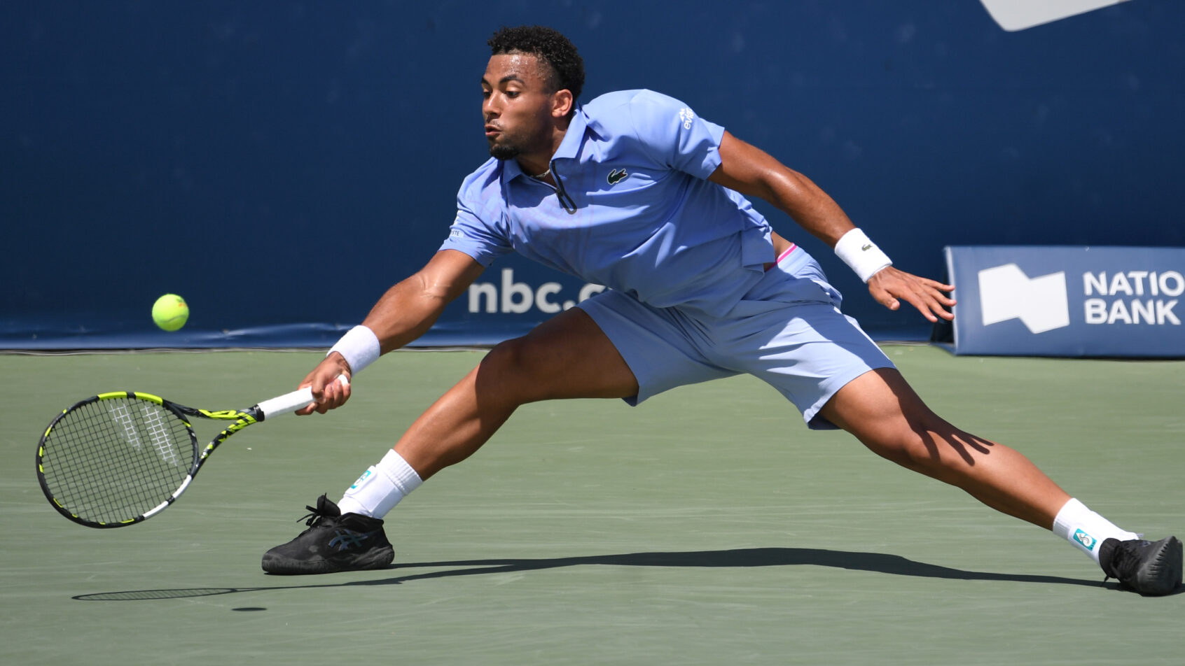 Arthur Fils stretches to hit a forehand