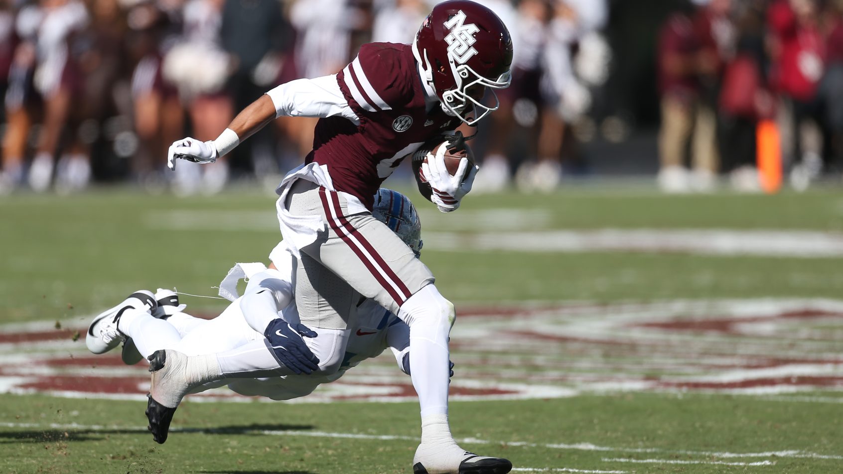 Brenen Thompson tries to break free from a Ole Miss tackle.