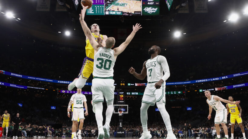 Los Angeles Lakers guard Austin Reaves drives against Boston Celtics forward Sam Hauser