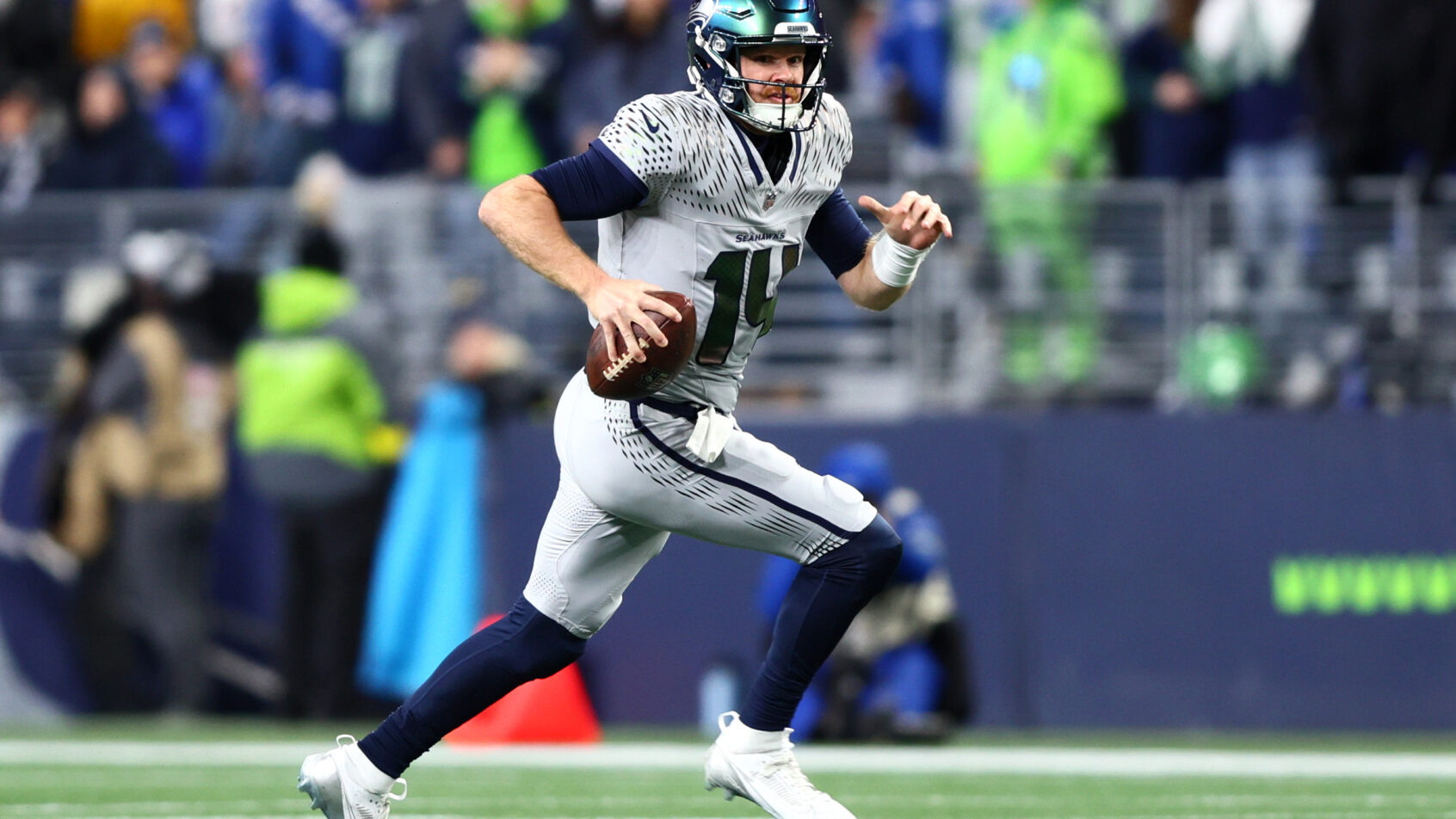 Seattle Seahawks quarterback Sam Darnold running with the ball