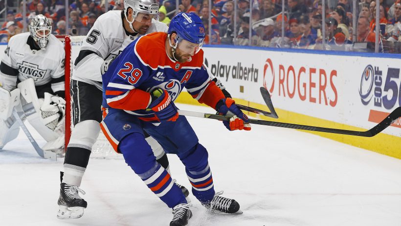 Edmonton Oilers forward Leon Draisaitl (29) and Los Angeles Kings defensemen Cody Ceci (5) battle along the boards