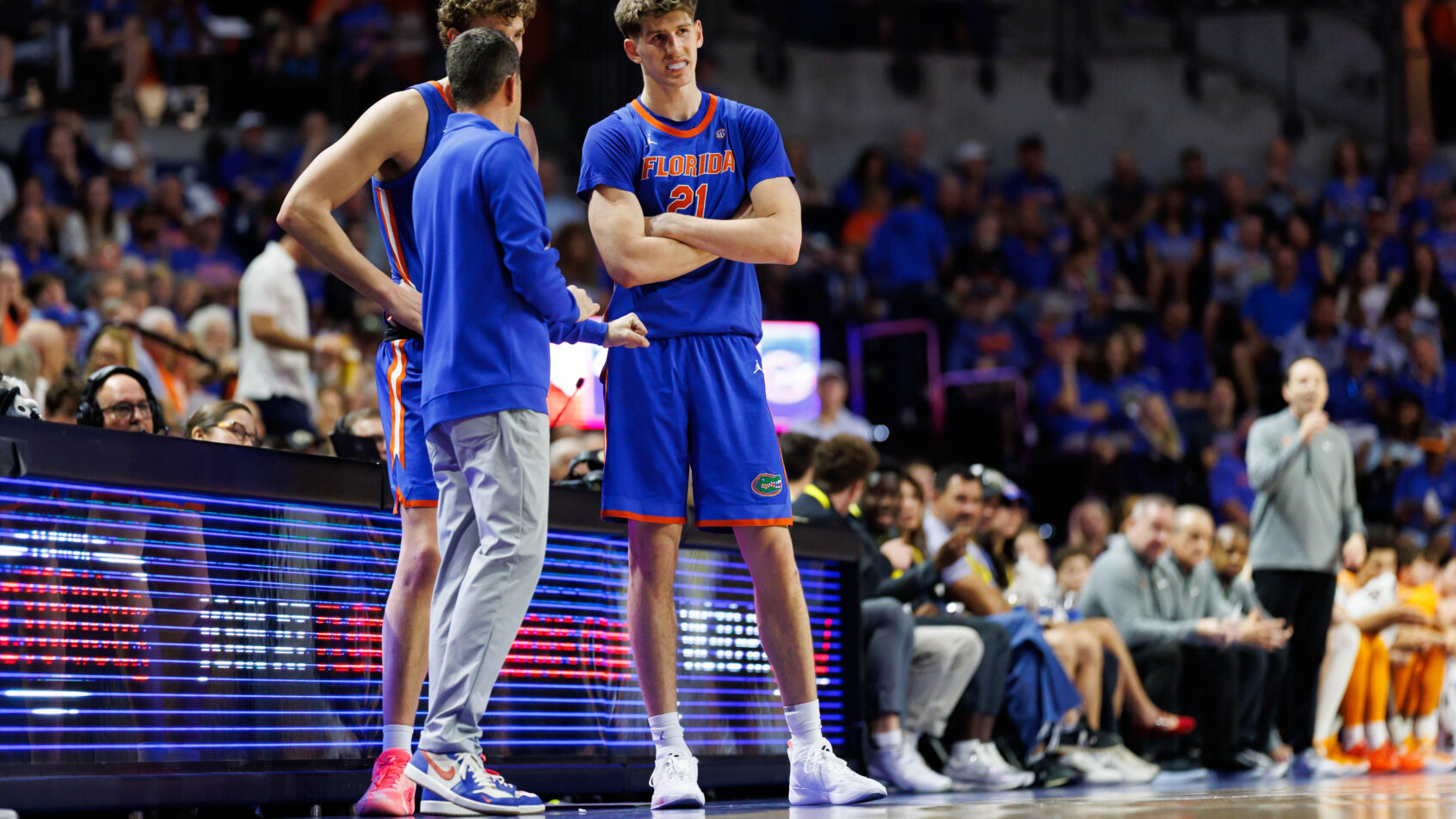 Florida Gators head coach Todd Golden talking to center Micah Handlogten