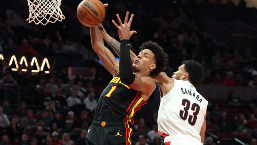 Atlanta Hawks forward Jalen Johnson grabs a rebound