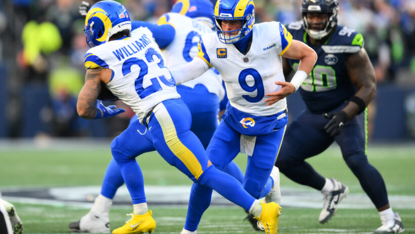 Los Angeles Rams quarterback Matthew Stafford hands the ball to running back Kyren Williams