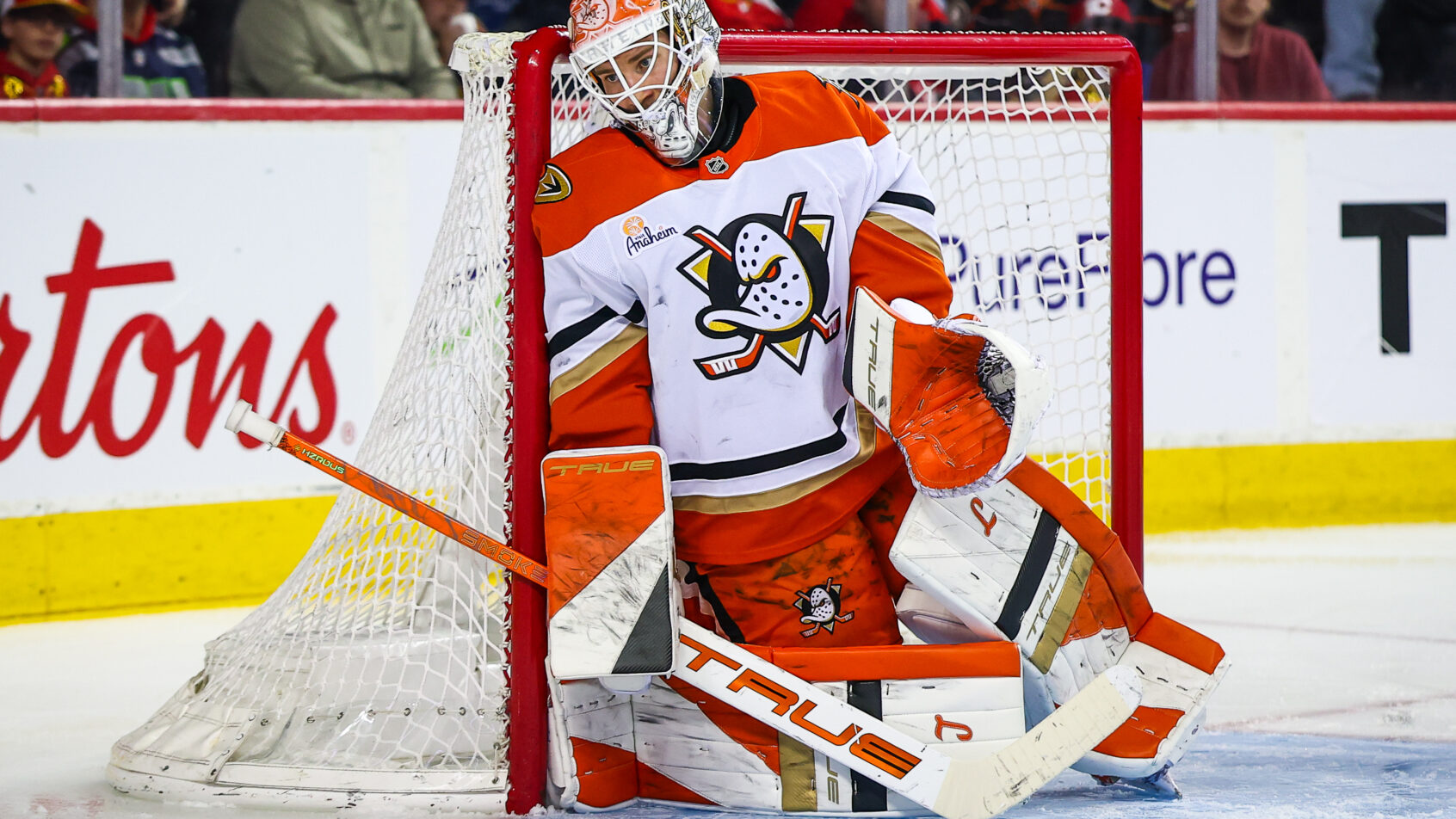 Lukas Dostal hugs the post in a game versus the Flames.